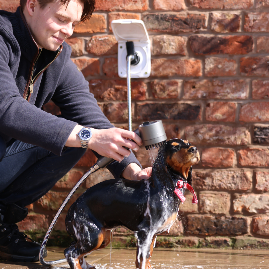 Outdoor shower rinsing off after the beach, the pool, the dog and the garden